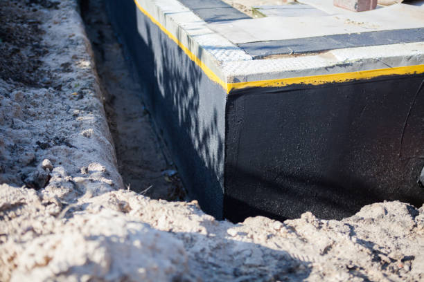 Professional Waterproofing technician working in Bunker Hill, IN